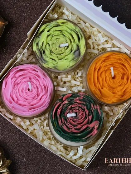 This gift box of four floral tea light candles features a beautiful swirled rose design in vibrant colors.
