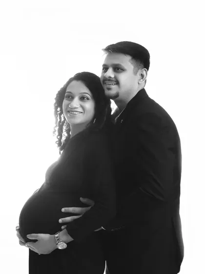 A duplicate of the hopeful couple's portrait, capturing their shared anticipation in black and white.