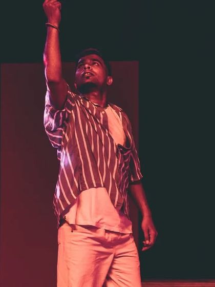 A student captured in a solo moment during a theatrical dance piece. My direction focuses on empowering each dancer to find their individual character and presence on stage.