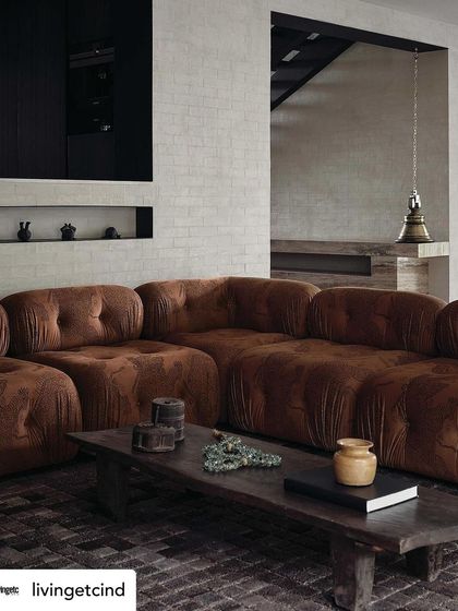 The living room at The Grove Residence, as featured in Livingetc magazine. The space is a perfect example of our "slow living" design philosophy, with its comfortable sofa and curated, meaningful objects.