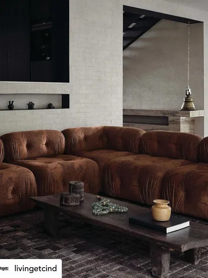 The living room at The Grove Residence, as featured in Livingetc magazine. The space is a perfect example of our "slow living" design philosophy, with its comfortable sofa and curated, meaningful objects.