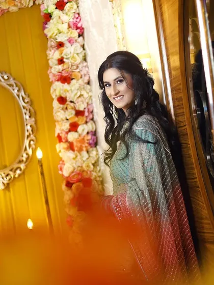 An artistic portrait of the bride-to-be, using the warm lighting and decor to create a dreamy and elegant atmosphere.