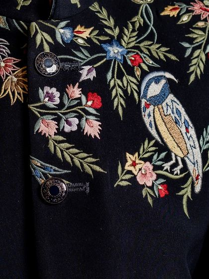 Another detailed shot of the hand embroidery on our Jashn Collection Indo-western jacket. The vibrant colors and fine threadwork create a piece of wearable art.