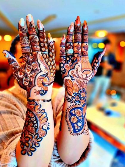 A unique fusion design that incorporates blue color accents. This modern technique adds a pop of color to the traditional henna, creating a truly one-of-a-kind look.