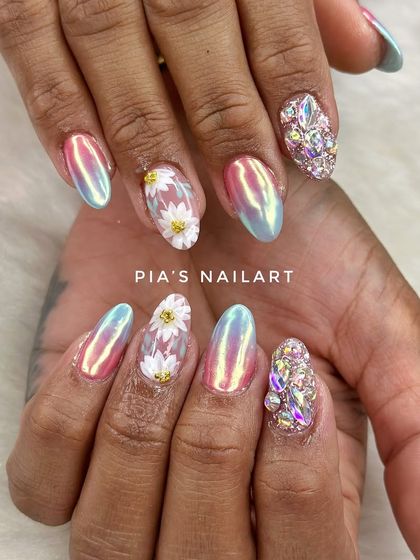Wedding nails featuring hand-drawn daisies over an iridescent chrome base, with a full-bling accent nail.