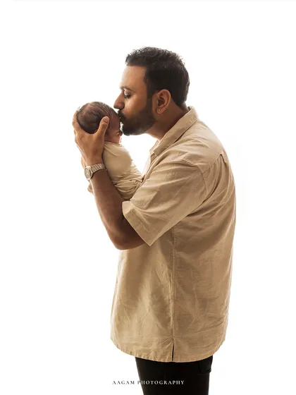 A tender kiss from dad. These are the unscripted moments of love that I aim to capture in every family session.