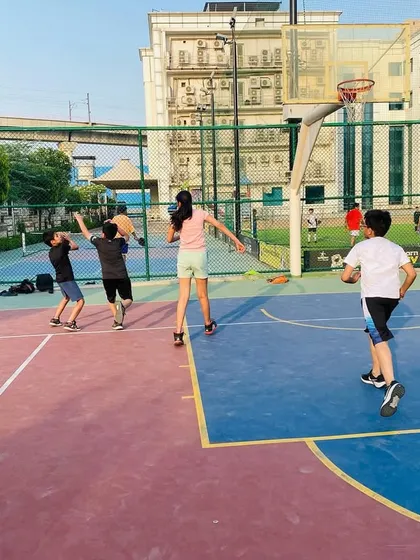 A junior player goes up for a rebound.