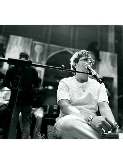 A black and white moment from a sound check, capturing the focus and concentration.