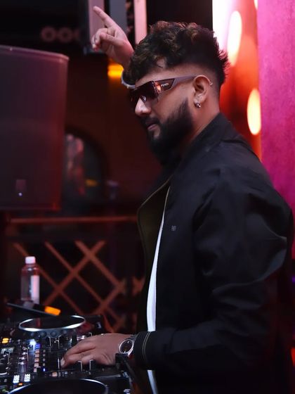 Pointing up, signaling the start of a high-energy track. Ready for 2025.