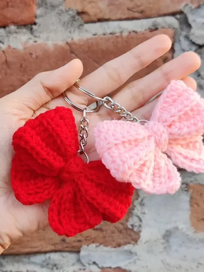 Coquette bow keychains available in a whole spectrum of colors, from bold reds and pinks to earthy tones.
