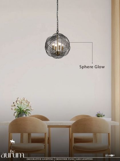 The 'Sphere Glow' pendant, with its woven metal design, casts beautiful, intricate shadows. I love using fixtures like this to add texture and a layer of visual interest to a minimalist dining space.