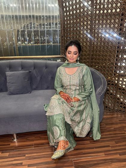 A serene pose showcasing the soft glam makeup for the Mehndi function.
