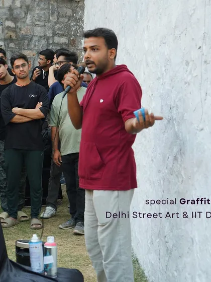 This is me, kicking off the workshop at IIT Delhi. I start by sharing the story of street art and explaining the basics, making sure everyone feels comfortable and inspired before they pick up a spray can. The goal is to demystify the art form.