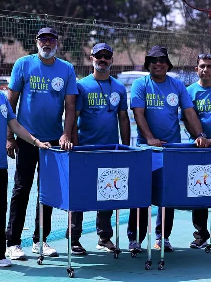 Our core team standing proudly with our branded, portable ball carts. This professional gear allows us to run organized and efficient training sessions anywhere.