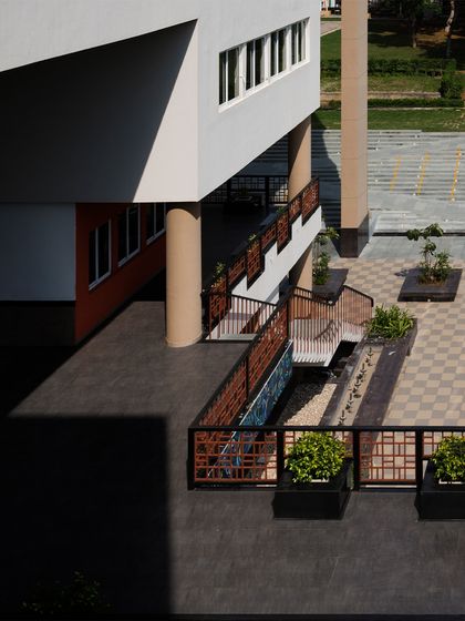 The interplay of volumes and voids at the Sushant School casts dramatic shadows throughout the day. This turns light into a design element that animates the built form, while the shaded outdoor areas provide comfortable learning and social zones.