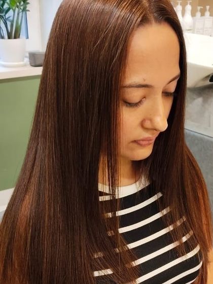 A sleek and straight hairstyle that looks effortlessly polished. This classic look is always in style.