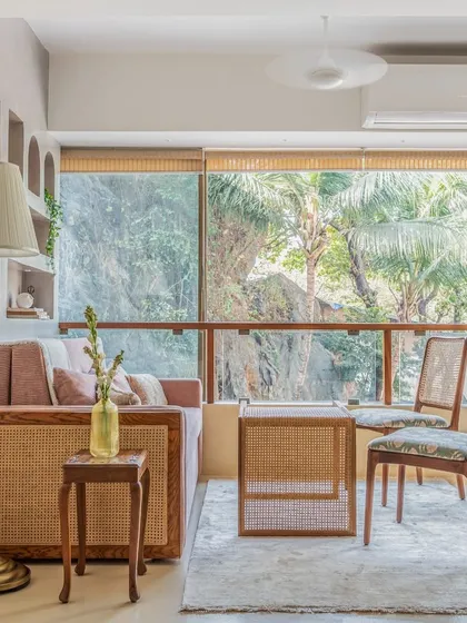 This space was designed to be multifunctional. It serves as a calm nutrition clinic by day and easily transforms into a cozy bedroom by night, with large windows that bring in the beautiful greenery from outside.