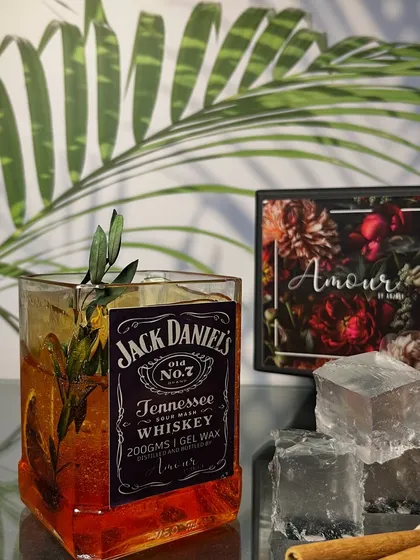 Another angle of the Jack Daniels whiskey candle. The gel wax gives it a realistic liquid look, complete with ice-like cubes and botanicals.