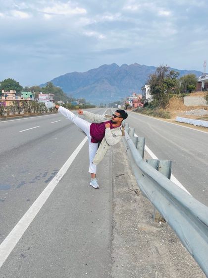 My power is my art. A high kick on the open road, surrounded by the mountains. Taekwondo is a part of me, wherever I go.