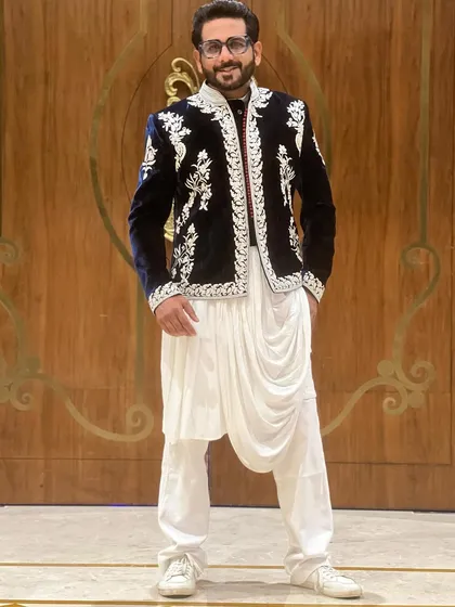 A full-length view of my Sufi night attire. The deep blue velvet jacket with intricate silver embroidery paired with a white draped kurta creates a look that is both royal and contemporary.