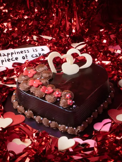 Celebrate love with our heart-shaped Dutch Truffle cake. This decadent chocolate cake is rich, moist, and adorned with delicate hearts, making it the perfect centerpiece for Valentine's Day, anniversaries, or just because.