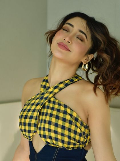 A serene, eyes-closed shot that conveys a sense of happiness and contentment. It's a beautiful lifestyle moment.