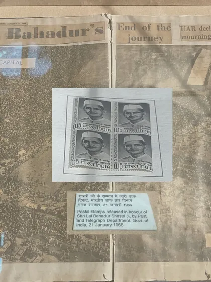 A display showing postal stamps issued in honour of Lal Bahadur Shastri in 1966. The issuance of commemorative stamps is a formal act of state recognition, cementing a leader's place in the national pantheon.