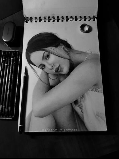 A different angle of the Sonam Bajwa sketch, showing my sketchbook and tools. This is my typical workspace when I get lost in a portrait.