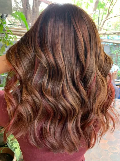 Another angle of the chestnut and red look, showing how the red slivers add a beautiful, subtle pop of color.