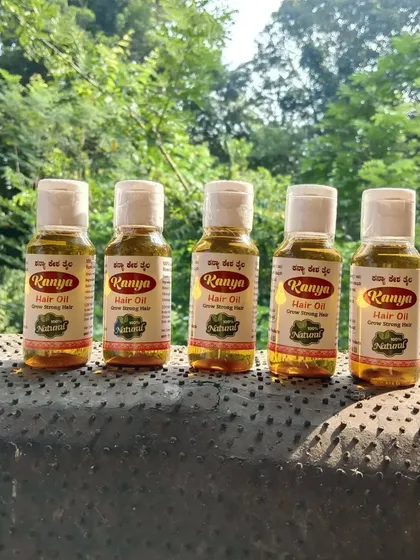 Another view of five bottles of my herbal hair oil, ready to be sent to a customer.