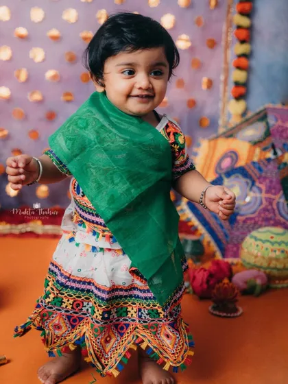 Look at that happy dance. This little girl is full of energy and excitement for the Navratri festivities.