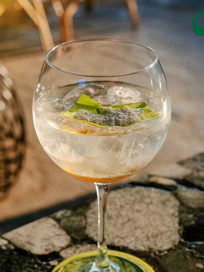 Raise a glass to good times. This signature cocktail, with its unique garnish, is a perfect example of the craft and creativity my bar team puts into every drink.