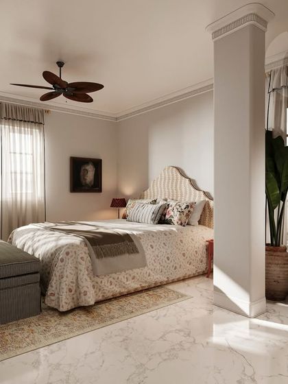 This bedroom was designed to reflect the client's vision of European vintage interiors. The space uses a soft, neutral palette, sheer drapery, and polished marble flooring to create an ambiance of understated grandeur and enduring sophistication.