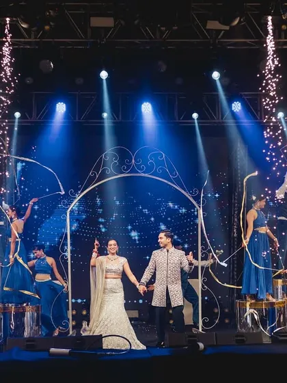 A couple's performance is the heart of the Sangeet. For Nipun and Roshni, we created this grand entry moment with aerial ribbon artists and pyrotechnics, setting the stage for their romantic duet in Udaipur.