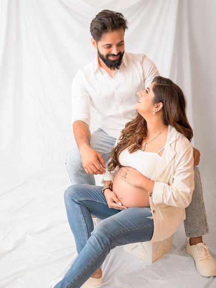 A relaxed, seated portrait that feels natural and authentic. This shows how we can create beautiful images that reflect your everyday love story.