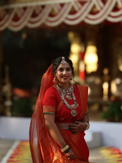 The perfect bridal twirl. Supritha looks absolutely radiant in her layered bridal set. The intricate design of the necklaces and the matching vaddanam (waist belt) are beautifully showcased in this happy moment.