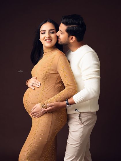 A sweet kiss on the cheek. This couple is just glowing with happiness and love.