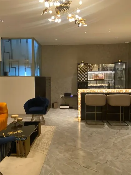 We loved being part of this beautiful entertainment space by Phylosophy Design Studio. Our vibrant orange sofa, deep blue accent chairs, and custom bar stools add a playful yet luxurious feel to this party pad.