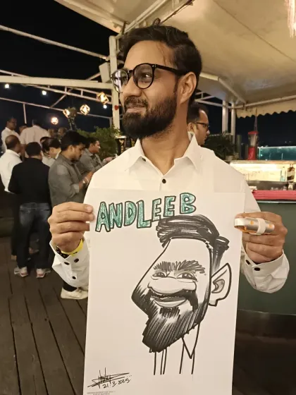 A stylish guest with his personalized caricature at Sky Lounge.