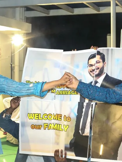 A heartwarming surprise for the groom. The family welcomes him with sparklers and a custom banner, making his wedding entry a truly special and inclusive family celebration.