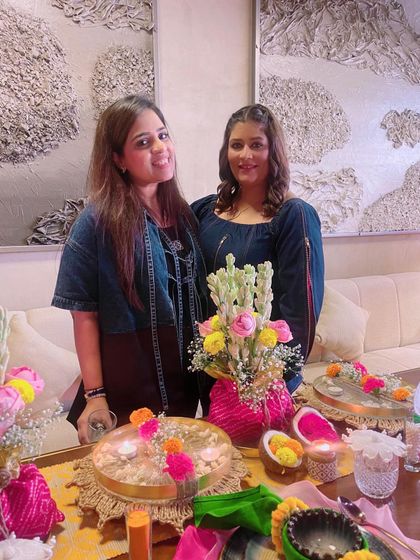 Two participants proudly showcasing their work. The sense of community and shared learning is what makes these workshops so special.