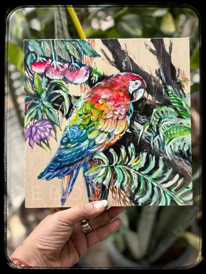 While I often work with watercolors, I also enjoy the vibrant, bold finish of acrylics. This colorful macaw, painted on a wood panel, shows the rich texture and depth that can be achieved with this versatile medium.