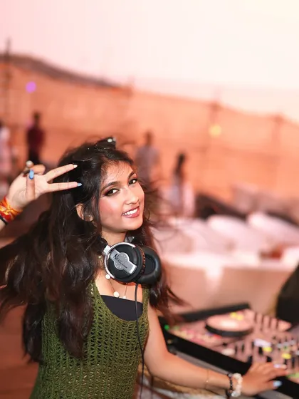 Peace, love, and beats. A happy moment captured during my sunset set at Elrow, Goa, with the beach party in full swing behind me.