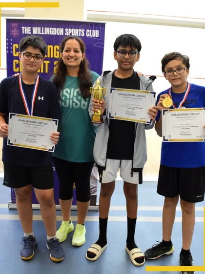 The top competitors in a junior boys category pose with their medals and trophies after a series of challenging matches.