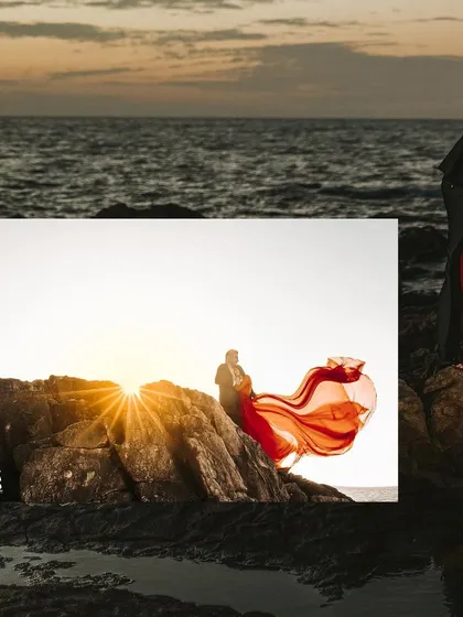 A stunning sunset shot where the bride's red dress catches the light perfectly, creating a beautiful silhouette effect.