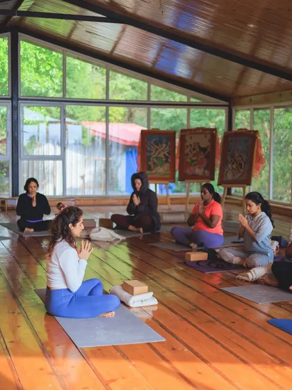 Leading a seated meditation with the group. Finding stillness together amplifies the collective energy and deepens our individual experience.