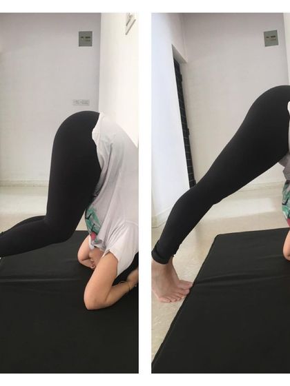 A student practices the preparatory steps for Sirsasana (Headstand). Building a strong foundation is the most important part of mastering any advanced pose.