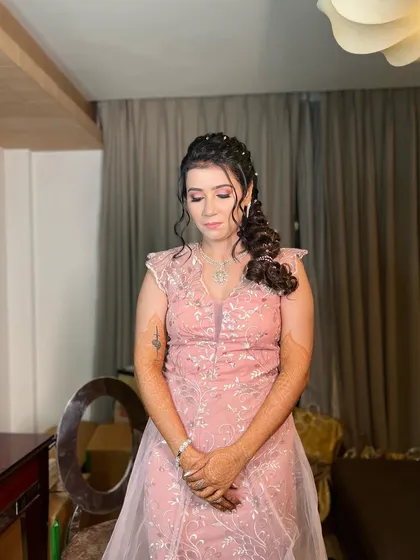 The full look, showing how this sparkling side braid complements a chic, modern gown for an evening event.
