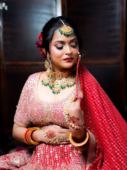 This pose captures a moment of quiet reflection, with the makeup looking flawless from every angle.