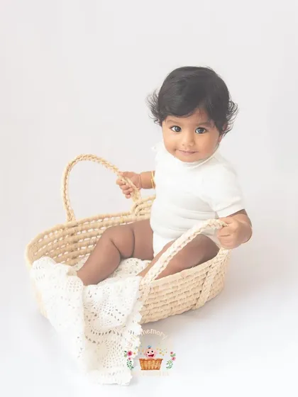 This little one looks so sweet sitting in this woven basket. Using simple, natural props can add a lovely texture and interest to the photos without being distracting.